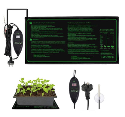 Seedling heat mat flat on bench with seedlings on top