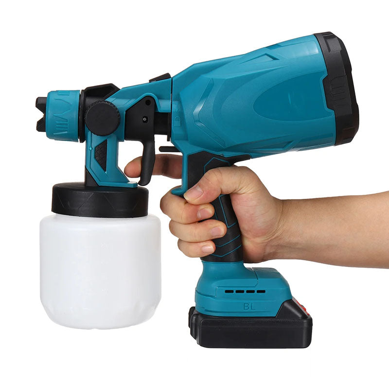 Paint sprayer gun spraying vertical pattern on wall