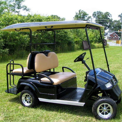 Golf cart side mirror showing clear reflective surface in daylight