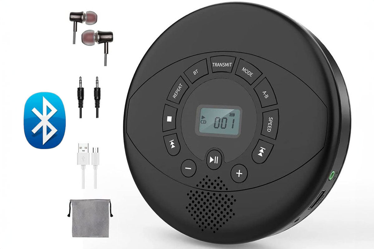 Portable CD player with headphones resting on table