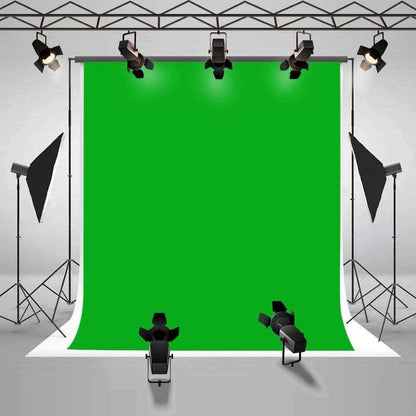 Green screen backdrop being cleaned with damp cloth