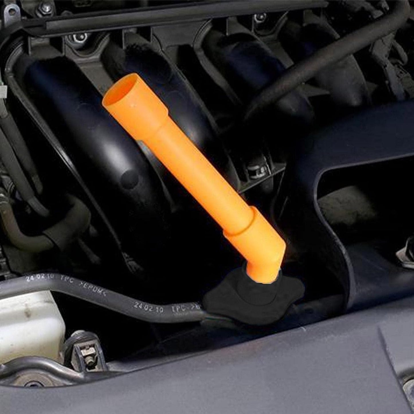 Coolant filling funnel kit demonstrating use under mudguard well