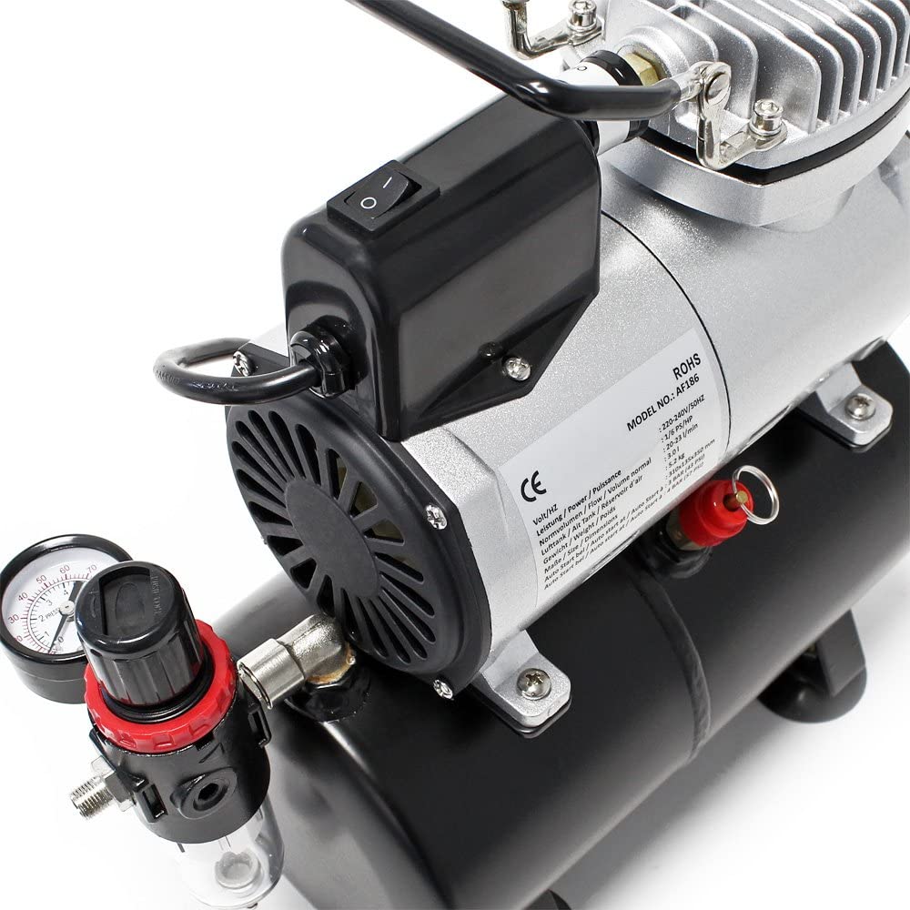 Air brush compressor with cooling fan visible at rear