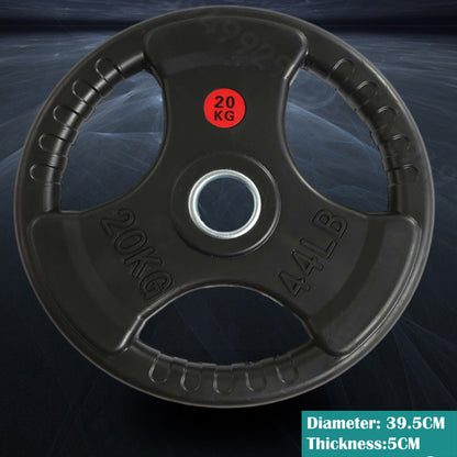 Olympic bumper weight plate 20kg resting on gym floor