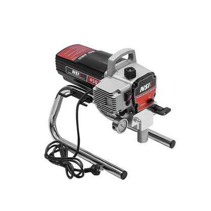 Airless paint sprayer being used on outdoor fence