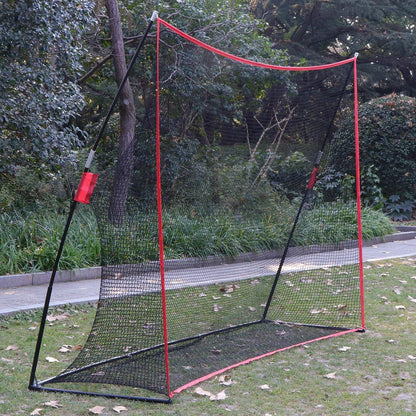Golf practice net with four stakes securing it to ground