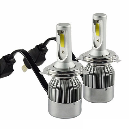 H4 LED car headlight bulb glowing in low light