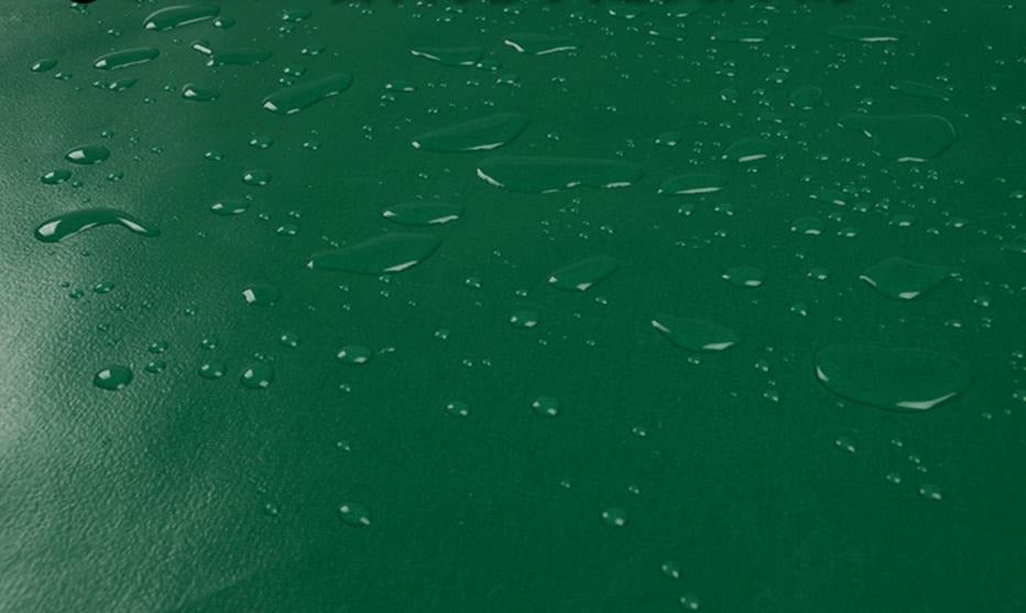 Green heavy duty tarpaulin tarp folded for easy carrying