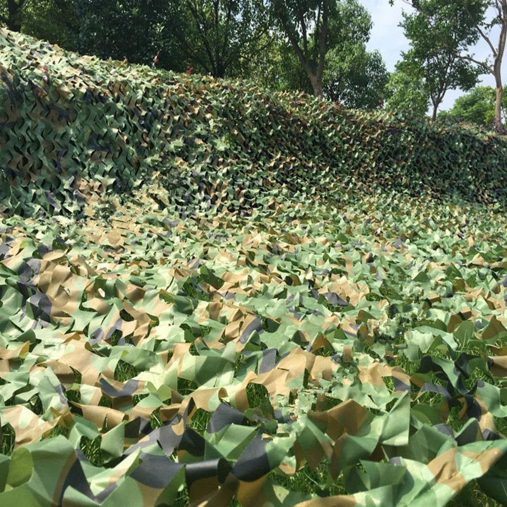 Camouflage net draped as backdrop for outdoor display