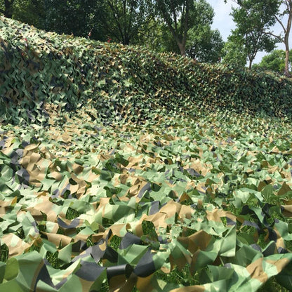 Camouflage net draped as backdrop for outdoor display
