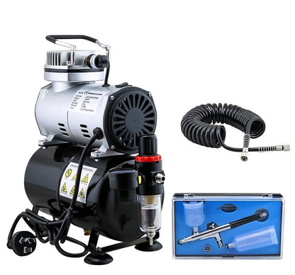 Air brush compressor connected to airbrush with hose attached