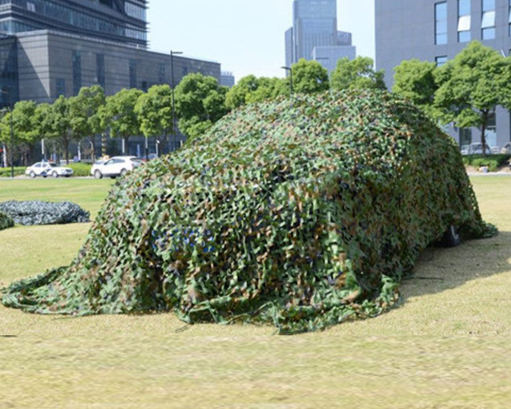 Edge of camouflage net with sewn loops for securing