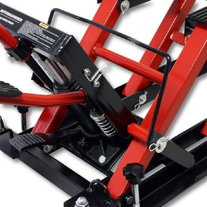 Motorcycle lifter jack in workshop setting lifting a quad bike