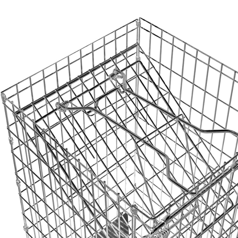 Possum trap large animal trap placed in garden setting for wildlife control