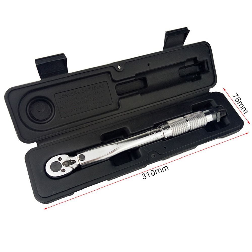 Torque wrench 12 inch being used on a car wheel nut