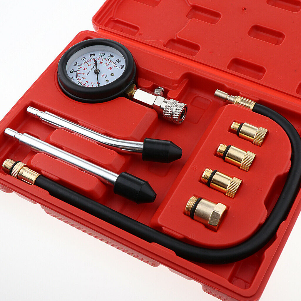 Compression tester set ready for use on motorcycle engine